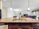 Spacious kitchen with a large island that opens up to the dining and living areas at 3744 Quaint Ln, Clermont, FL 34711