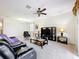 Relaxing living area with comfortable seating, a ceiling fan, and natural light at 3744 Quaint Ln, Clermont, FL 34711