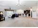 Spacious living room open to kitchen, with sliding glass doors leading to outdoor space at 3744 Quaint Ln, Clermont, FL 34711