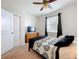 Comfortable main bedroom featuring a TV, ceiling fan, and ensuite bathroom access at 3744 Quaint Ln, Clermont, FL 34711