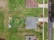 Aerial view of home with lawn, fence, and view of neighborhood at 382 Lake St, Umatilla, FL 32784