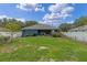Spacious fenced backyard with lawn, patio and room for outdoor activities at 382 Lake St, Umatilla, FL 32784