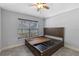 This bedroom features a large window allowing for natural light and a large bedframe with built-in storage at 382 Lake St, Umatilla, FL 32784
