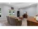 Spacious living room with a comfortable sofa and views of the backyard through sliding glass doors at 382 Lake St, Umatilla, FL 32784