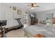 Spacious main bedroom features tile flooring, ceiling fan, walk-in closet and a lovely en-suite bathroom at 382 Lake St, Umatilla, FL 32784