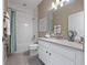 Sparkling bathroom with white vanity, modern fixtures, and a shower-tub combination at 4413 Lions Gate Ave, Clermont, FL 34711