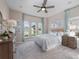 Cozy bedroom with plush carpeting, neutral walls, and elegant furniture at 4413 Lions Gate Ave, Clermont, FL 34711