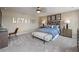 Relaxing bedroom featuring a ceiling fan, a comfortable bed and stylish decor and modern furnishings at 4413 Lions Gate Ave, Clermont, FL 34711