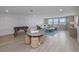 Relaxing bonus room, featuring unique geometric accent wall and comfortable seating for entertaining at 4413 Lions Gate Ave, Clermont, FL 34711