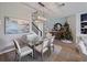 Formal dining room offers a stylish space for Gathering and entertaining with modern chandelier at 4413 Lions Gate Ave, Clermont, FL 34711