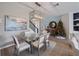 An open dining area adjacent to the living area showcasing a glass table and view to the staircase at 4413 Lions Gate Ave, Clermont, FL 34711