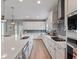 Modern kitchen boasts quartz countertops, a kitchen island and stainless steel appliances at 4413 Lions Gate Ave, Clermont, FL 34711