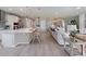 Open-concept kitchen, with white countertops, stainless steel appliances, and a large kitchen island at 4413 Lions Gate Ave, Clermont, FL 34711