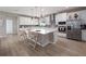 Expansive kitchen with a large island, stainless steel appliances, and ample cabinet space at 4413 Lions Gate Ave, Clermont, FL 34711