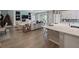 Open-concept living area featuring modern decor, fireplace and outdoor views at 4413 Lions Gate Ave, Clermont, FL 34711