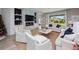 Bright living room features large windows and a cozy fireplace at 4413 Lions Gate Ave, Clermont, FL 34711