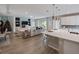 An open-concept living area adjacent to the kitchen and dining area at 4413 Lions Gate Ave, Clermont, FL 34711