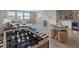 Living room featuring a foosball table, stylish decor and hardwood floors at 4413 Lions Gate Ave, Clermont, FL 34711