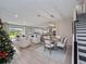 Open concept living area with dining space, modern lighting, and seamless flow to the kitchen at 4413 Lions Gate Ave, Clermont, FL 34711