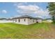 The backyard features a freshly cut lawn with ample space for outdoor activities at 4780 Sw 129Th Pl, Ocala, FL 34473