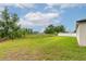 The spacious backyard is well-maintained, has fresh grass, and provides plenty of space at 4780 Sw 129Th Pl, Ocala, FL 34473