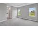 Bedroom featuring plush carpeting, two large windows, and neutral paint at 4780 Sw 129Th Pl, Ocala, FL 34473