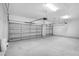 Spacious two car garage with white walls and gray doors at 4780 Sw 129Th Pl, Ocala, FL 34473