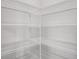 An organized, empty walk-in pantry with white wire shelving for ample storage space at 4780 Sw 129Th Pl, Ocala, FL 34473