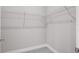 Empty walk-in closet with wire shelving and neutral carpeting at 4780 Sw 129Th Pl, Ocala, FL 34473