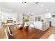 Open concept dining area connects the living room and modern kitchen, perfect for entertaining and everyday living at 4858 Brenda Dr, Orlando, FL 32812