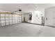 Spacious two car garage with a painted floor and white walls at 4858 Brenda Dr, Orlando, FL 32812