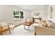 Sunlit living room featuring stylish furnishings and large windows that floods the space with natural light at 4858 Brenda Dr, Orlando, FL 32812