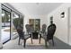 Screened in patio with black plastic patio furniture at 4858 Brenda Dr, Orlando, FL 32812