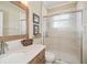 Well-lit bathroom featuring granite counters and a sliding glass shower at 489 Penny Ln, Maitland, FL 32751
