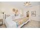 Spacious bedroom offering a ceiling fan, tiled floors, and an ensuite bathroom at 489 Penny Ln, Maitland, FL 32751