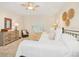 Stylish bedroom featuring shutters, decorative wall art, and tiled flooring at 489 Penny Ln, Maitland, FL 32751