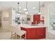 Stylish kitchen with custom cabinetry, stainless appliances, and a spacious island at 489 Penny Ln, Maitland, FL 32751