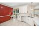 Open kitchen featuring white cabinetry, granite countertops, and modern appliances at 489 Penny Ln, Maitland, FL 32751