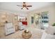 Open living room featuring access to the lanai and outdoor pool area at 489 Penny Ln, Maitland, FL 32751