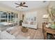 Inviting living room featuring lanai access, neutral decor, and comfortable seating at 489 Penny Ln, Maitland, FL 32751