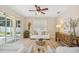 Bright living room featuring sliding doors to the lanai and neutral furnishings at 489 Penny Ln, Maitland, FL 32751
