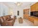 Comfortable living room with shuttered windows, hardwood floors, and cozy seating at 489 Penny Ln, Maitland, FL 32751