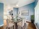 Dining room featuring a glass table, elegant chairs, stylish decor, and hardwood floors at 4942 Eden View Ct, Orlando, FL 32810