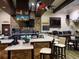 Stylish bar area with stone accents, ample seating, and television screens at 541 Arena Dr, Davenport, FL 33837