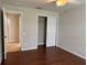 Bedroom features hardwood floors, a ceiling fan, and closet for your convenience at 541 Arena Dr, Davenport, FL 33837