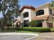 Close up of the exterior with stone accents and manicured hedges at 541 Arena Dr, Davenport, FL 33837