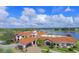 Beautiful exterior of the community clubhouse with well-manicured landscaping at 541 Arena Dr, Davenport, FL 33837