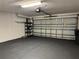 Spacious garage with epoxy flooring, shelving, and ample room for parking and storage at 541 Arena Dr, Davenport, FL 33837