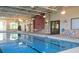 Bright indoor pool area with large windows and modern design at 541 Arena Dr, Davenport, FL 33837