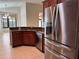 Kitchen area equipped with stainless steel appliances, granite countertops, and dark cabinetry at 541 Arena Dr, Davenport, FL 33837